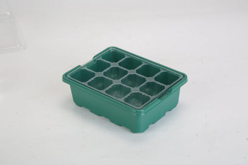 One green 12-cell seed starter tray shown empty.