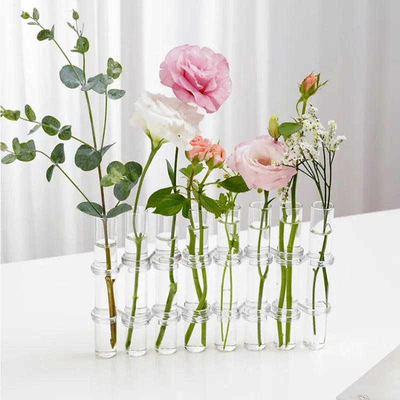 Six clear tubes in a hinged holder displaying cut stems; plants are not included.